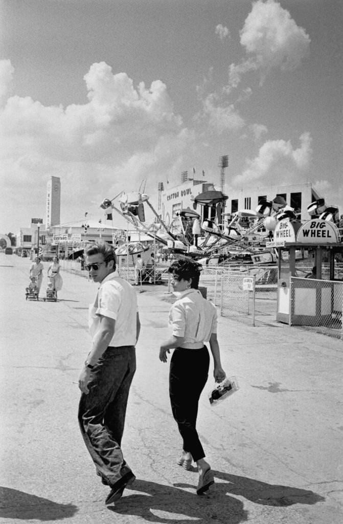 James Dean and actress Elizabeth Tayor attend the Texas State Fairgrounds on a weekend break during the filming of the movie "Giant".