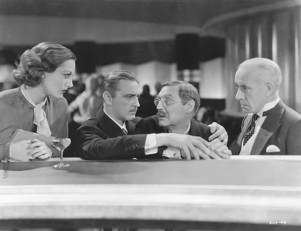 Joan Crawford. John Barrymore, Lionel Barrymore, and Lewis Stone in the 1932 film Grand Hotel.