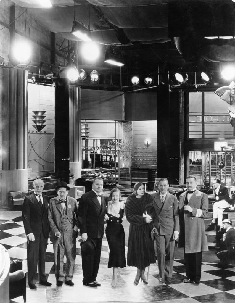 Lewis Stone, Lionel Barrymore, Wallace Beery, Joan Crawford, Greta Garbo, John Barrymore and Jean Hersholt on the set of Grand Hotel, 1932