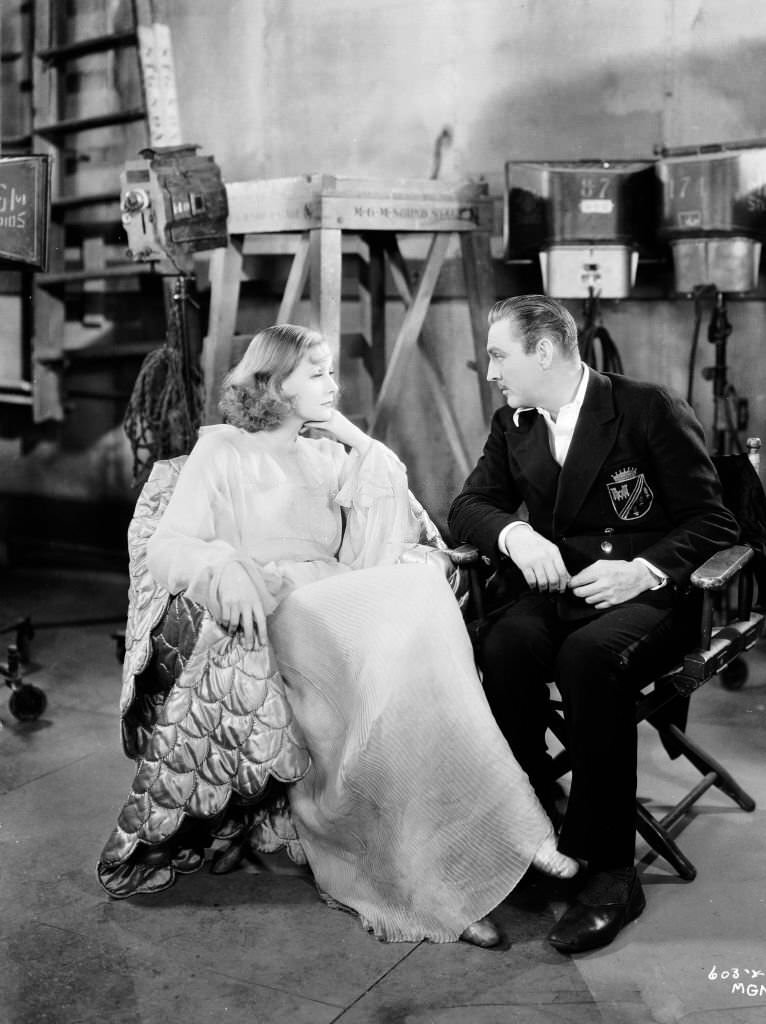 John Barrymore (and Greta Garbo chatting on the set of 'Grand Hotel', 1932