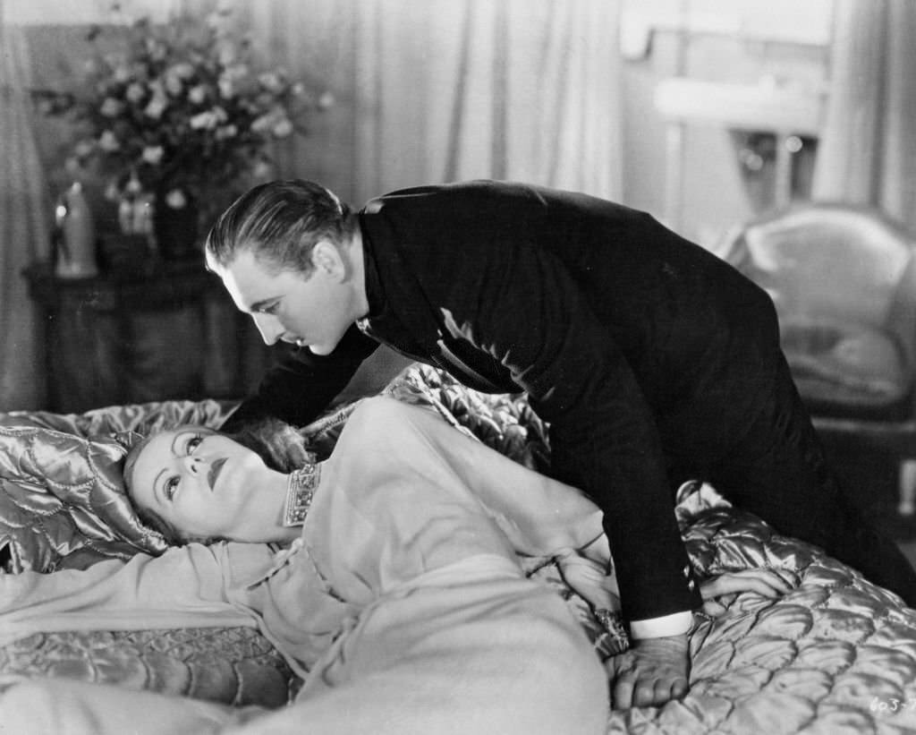 Greta Garbo as John Barrymore is about to join her in a scene from the film 'Grand Hotel', 1932.