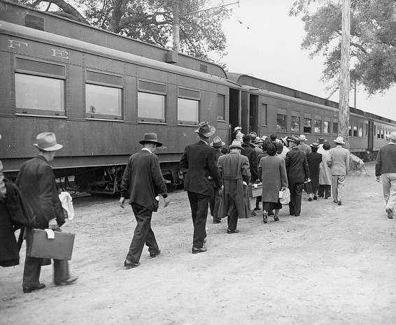 Evacuees boarding a special train at Santa Anita (California) Assembly Center enroute to a War Relocation Center.