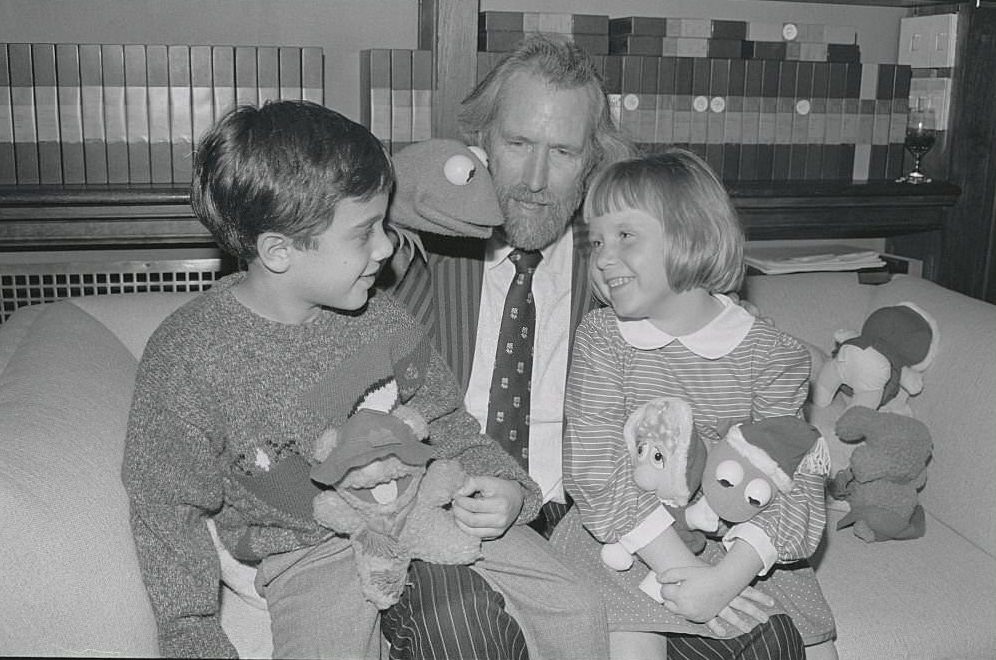 Jim Henson and Kermit The Frog give some of the Muppet Baby Plush dolls to two youngsters during a press interview on October 18th.
