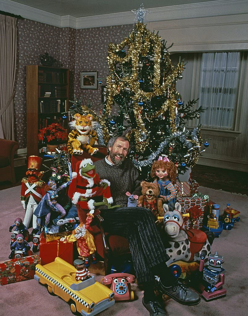Jim Henson with muppet characters from the ABC TV movie 'The Christmas Toy', directed by Eric Till, 1986.