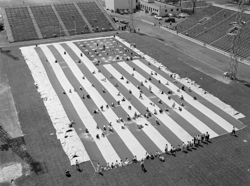 Cleaning old glory, Detroit, 1955.