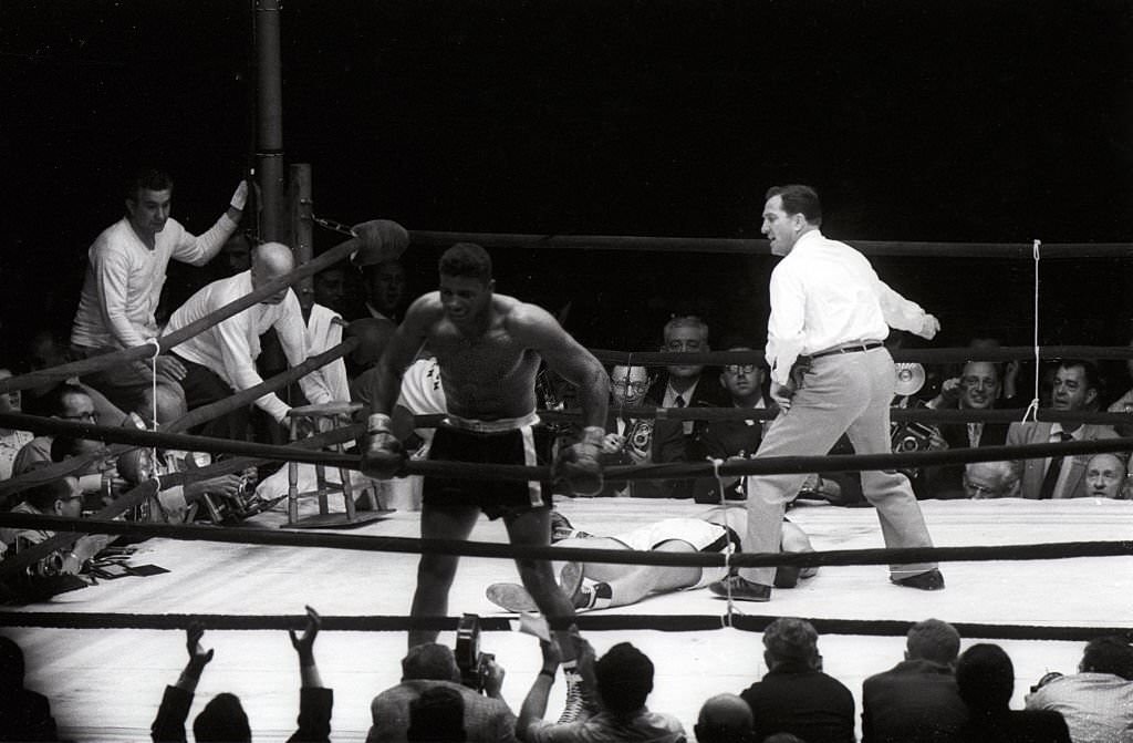 Floyd Patterson victorious after winning bout by knockout vs Ingemar Johansson at Polo Grounds, 1960.