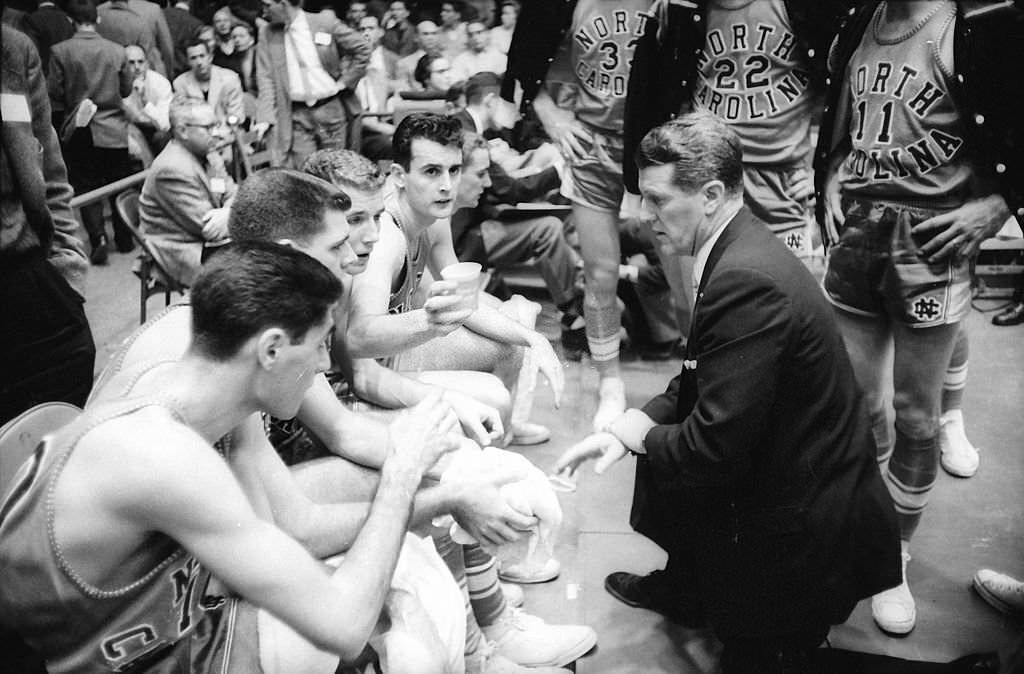 UNC head coach Frank McGuire and team in the locker room.