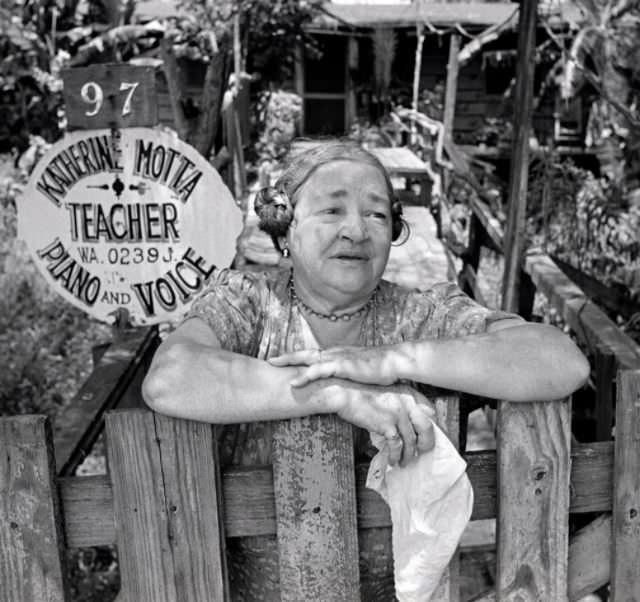 Music teacher Katherine Motta in front of her home, 1953.