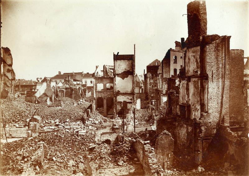 Rubble near twin towers and velocipede shop, Leuven, August 1914