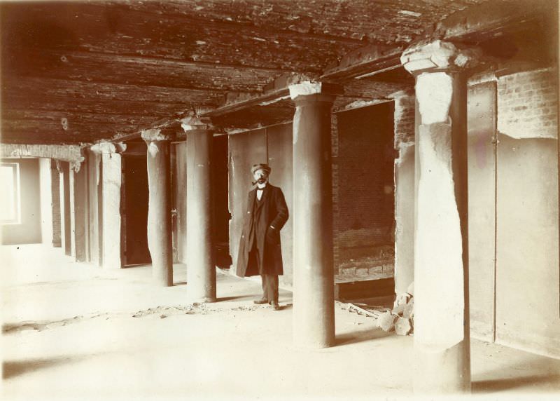 Theatre ruins, man in basement, Leuven, August 1914