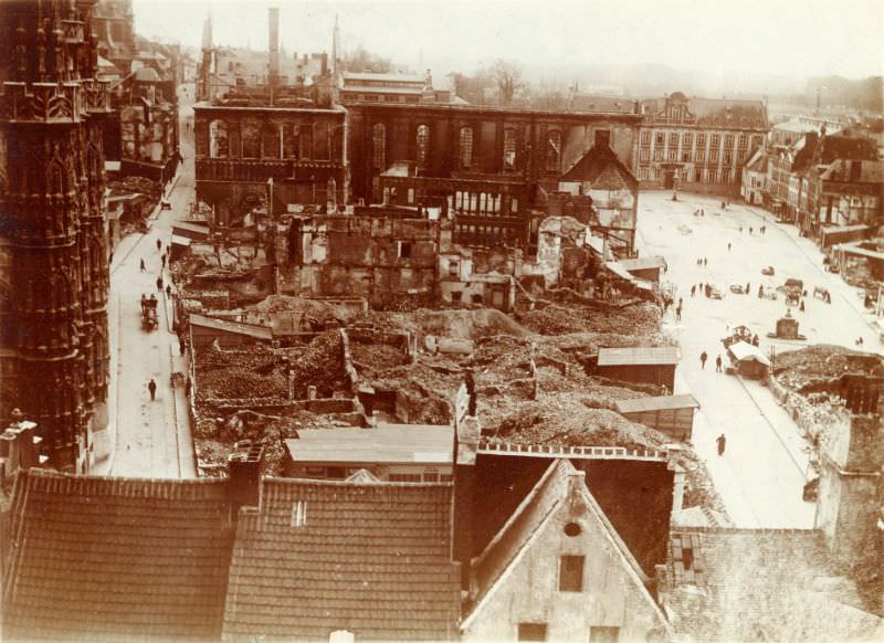City Hall and university library ruins. City Hall on left, Grote Markt on right, Leuven, August 1914