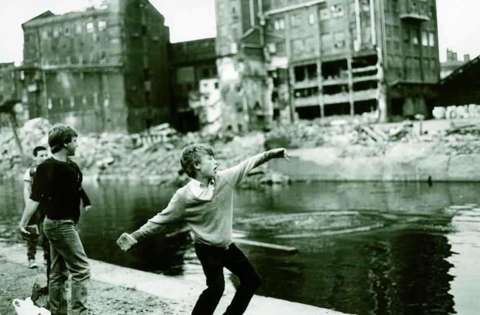 Lad throwing rock into the Leeds–Liverpool Canal