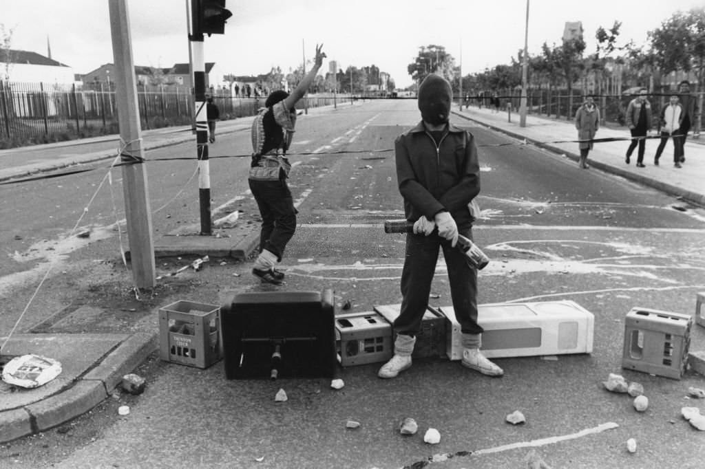 A youth wearing a balaclava and holding bottles, during rioting in the Toxteth area of Liverpool, 5th July 1981.