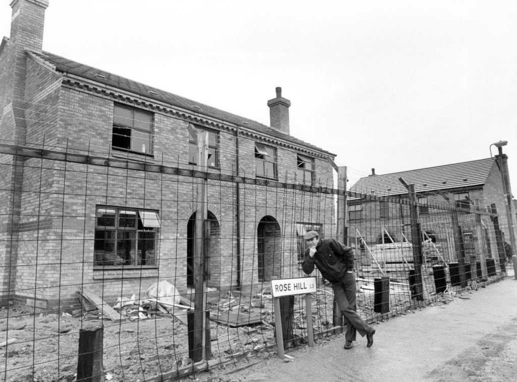 John McShane, chairman of the Gerard Community Housing Tenant Participation scheme, standing outside a new house being built on Rose Hill, 22nd January 1986