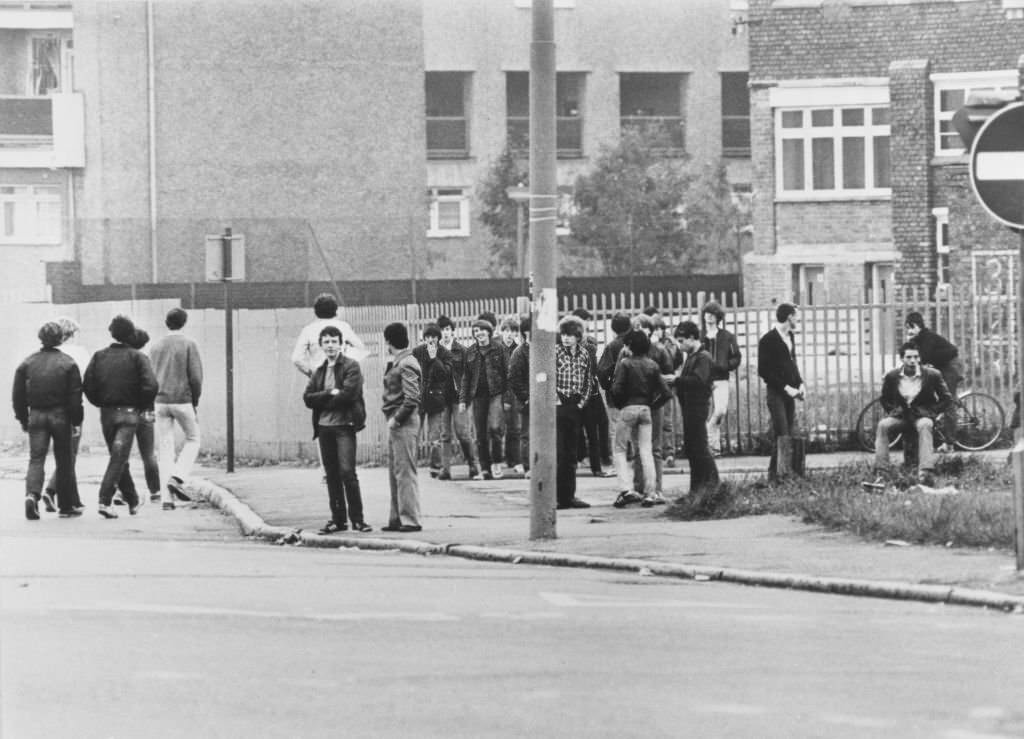 A crowd of youths standing on a street corner before rioting started in the Toxteth area of Liverpool, England, July 1981.