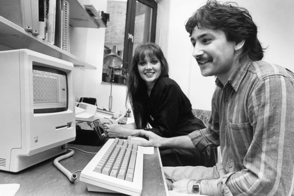 Computer textile designers Yvonne Robertson an d Nairish Nash with their Apple Mac computer. 30th September 1987.