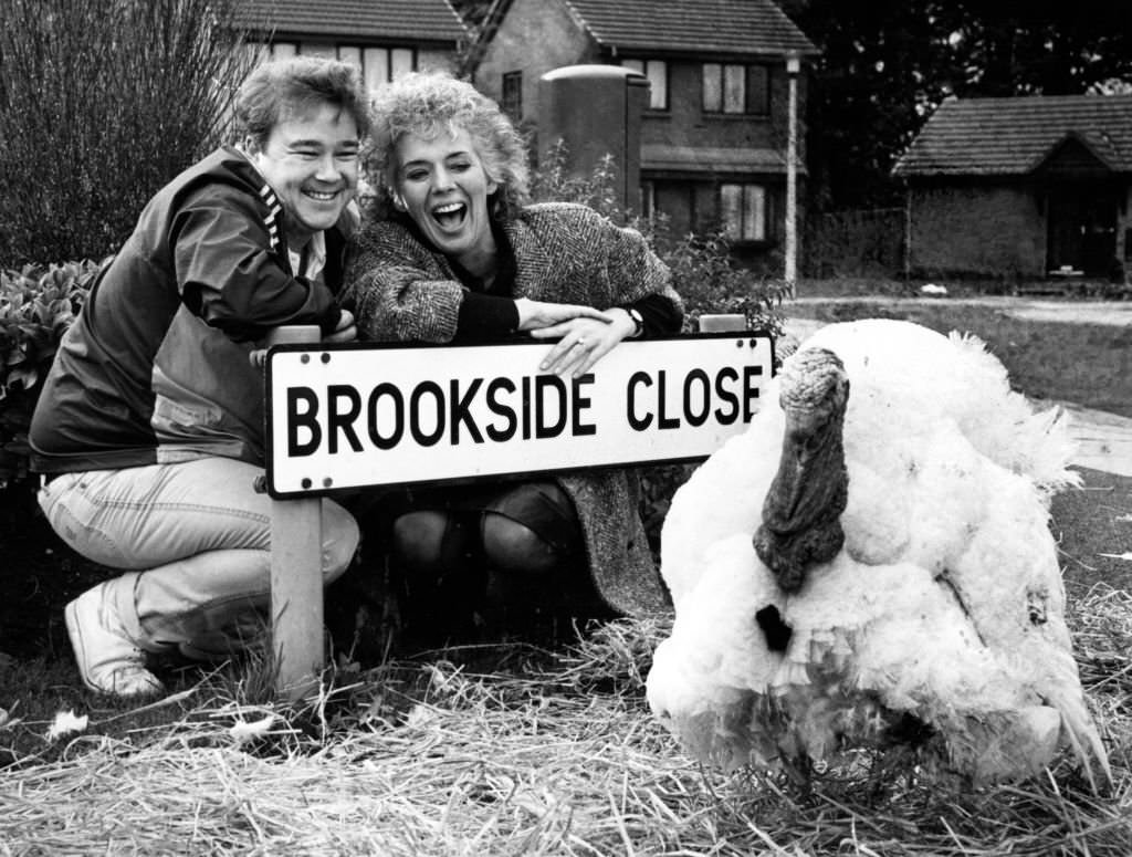 Michael stark and Sue Johnston from the Brookside cast with Trevor the Turkey, 6th November 1985.
