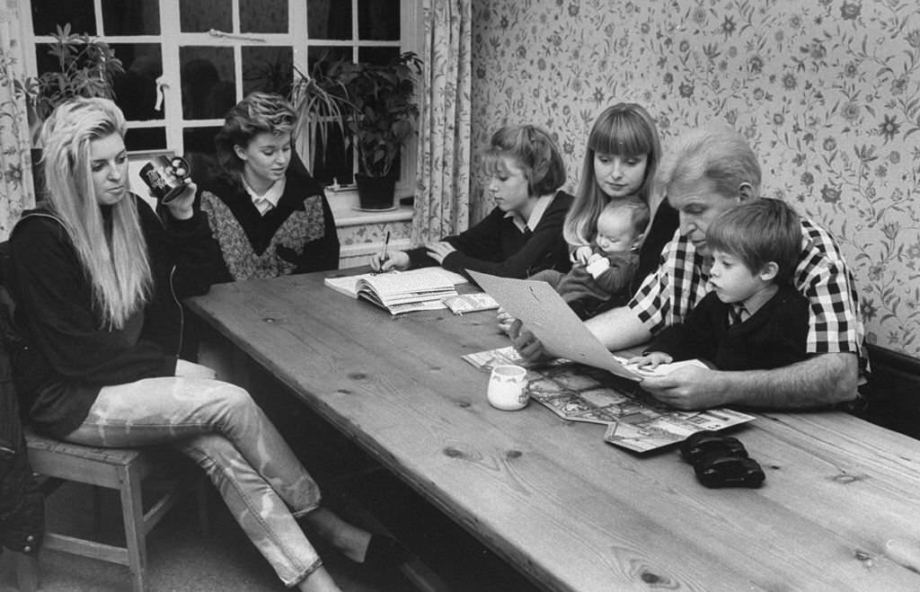 Photographer Mike McCartney, brother of Paul McCartney, at table with wife, Rowena & kids Theran, Benna, Abbi, Max & Josh.