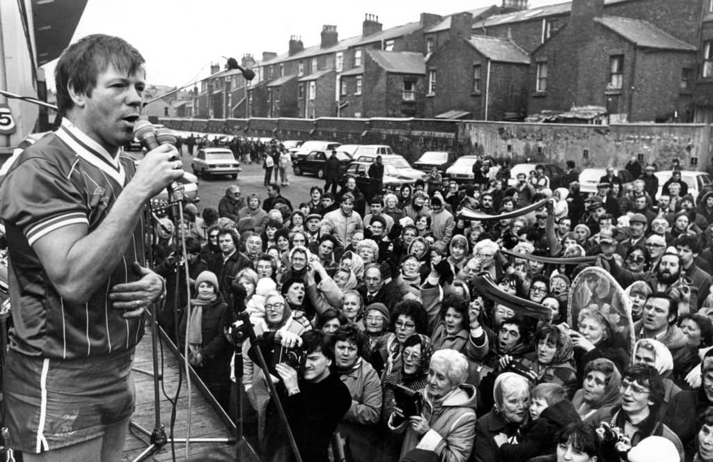 Radio star Billy Butler entertains a crowd of 300 fans at Anfield with a version of Top anthem 'You'll Never Walk Alone'. Clad in a Liverpool FC strip, 1983