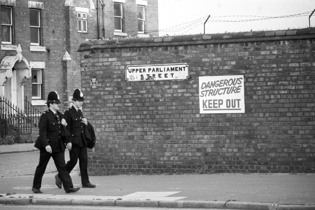 Police officers on Upper Parliament Street, in Toxteth, Liverpool in the aftermath of the Toxteth Riots.