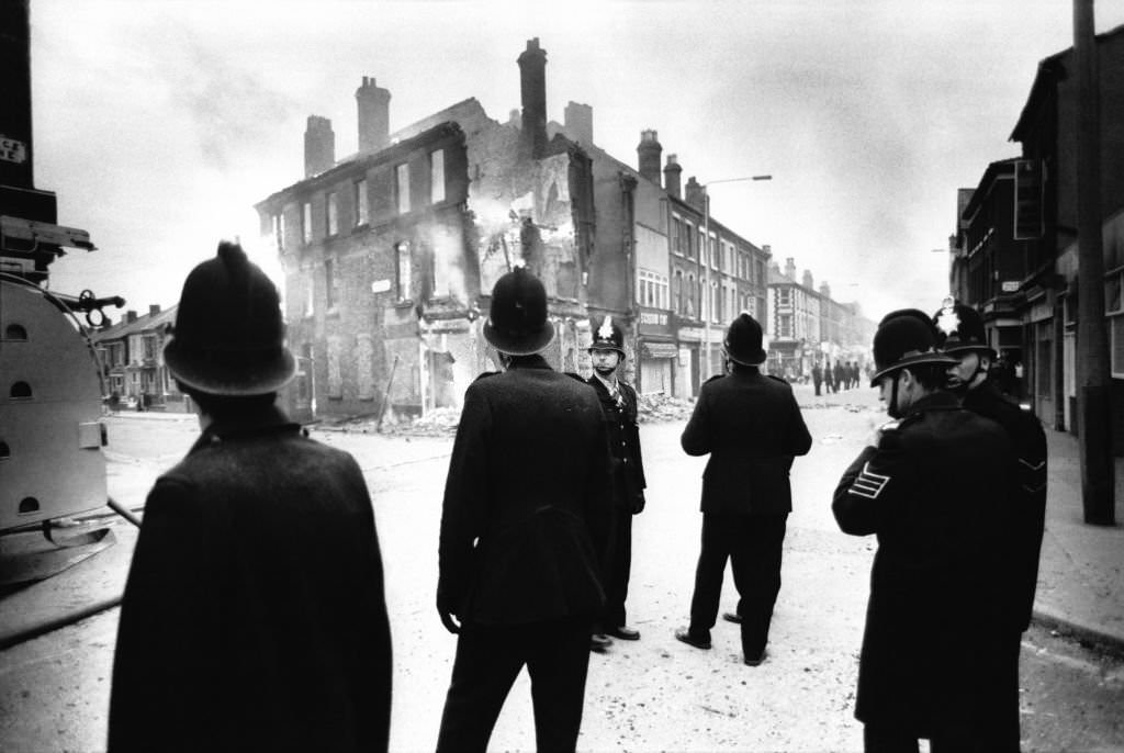 Police after the race riots in the Toxteth area of Liverpool in July 1981