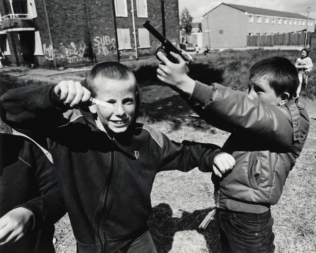 Two young boys playing out their frustrations, violence and confrontation was evident on the streets on Liverpool. 1982.