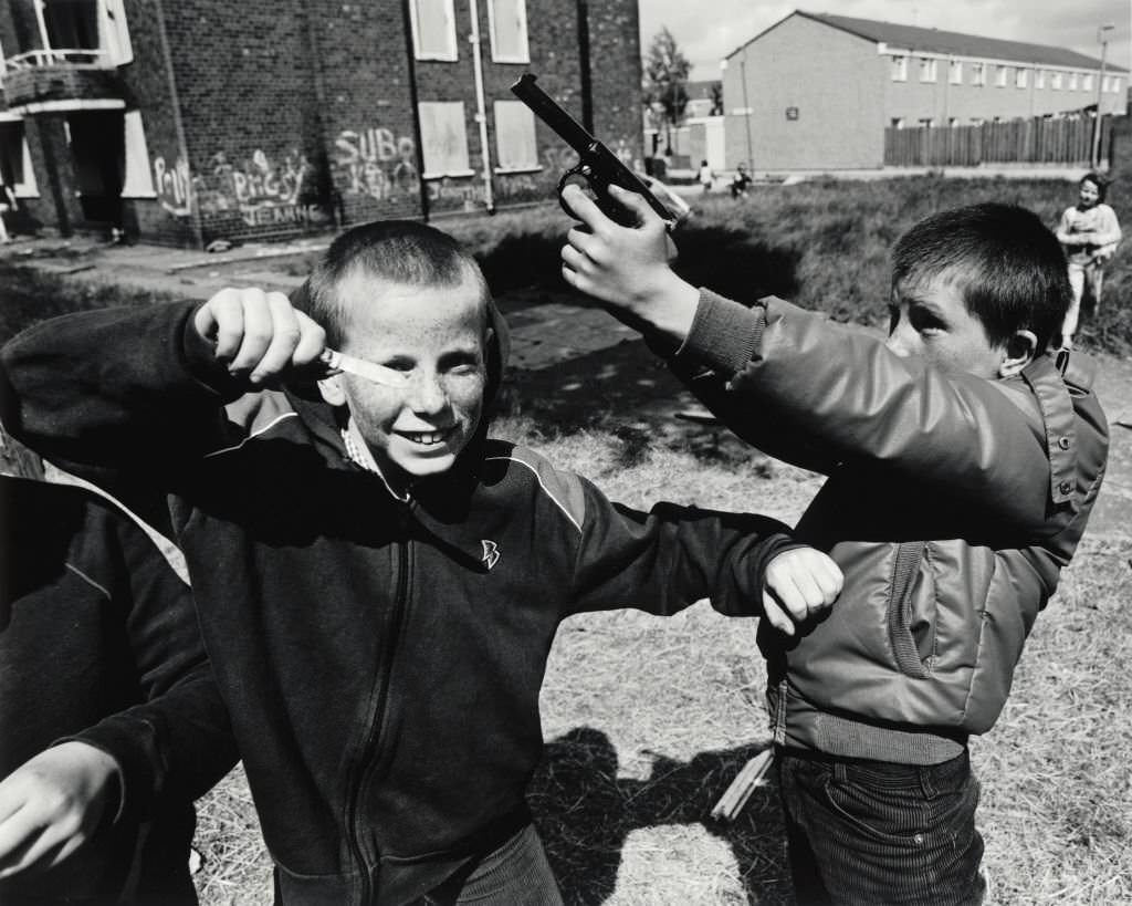 Two young boys playing out their frustrations, violence and confrontation was evident on the streets on Liverpool. 1982.