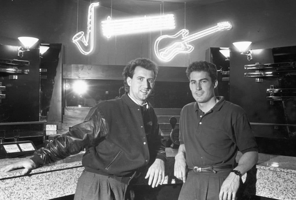 Disc jockey Pez (left) and manager Steve Fleury seen here in the cocktail bar of the Bedrock night club 17th June 1989.