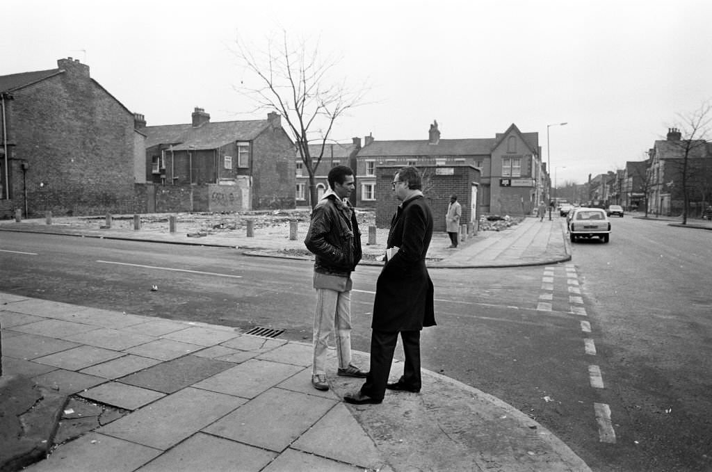 Lord Gifford talks to local resident Delroy Burris in Granby Street, Toxteth, 29th November 1988.