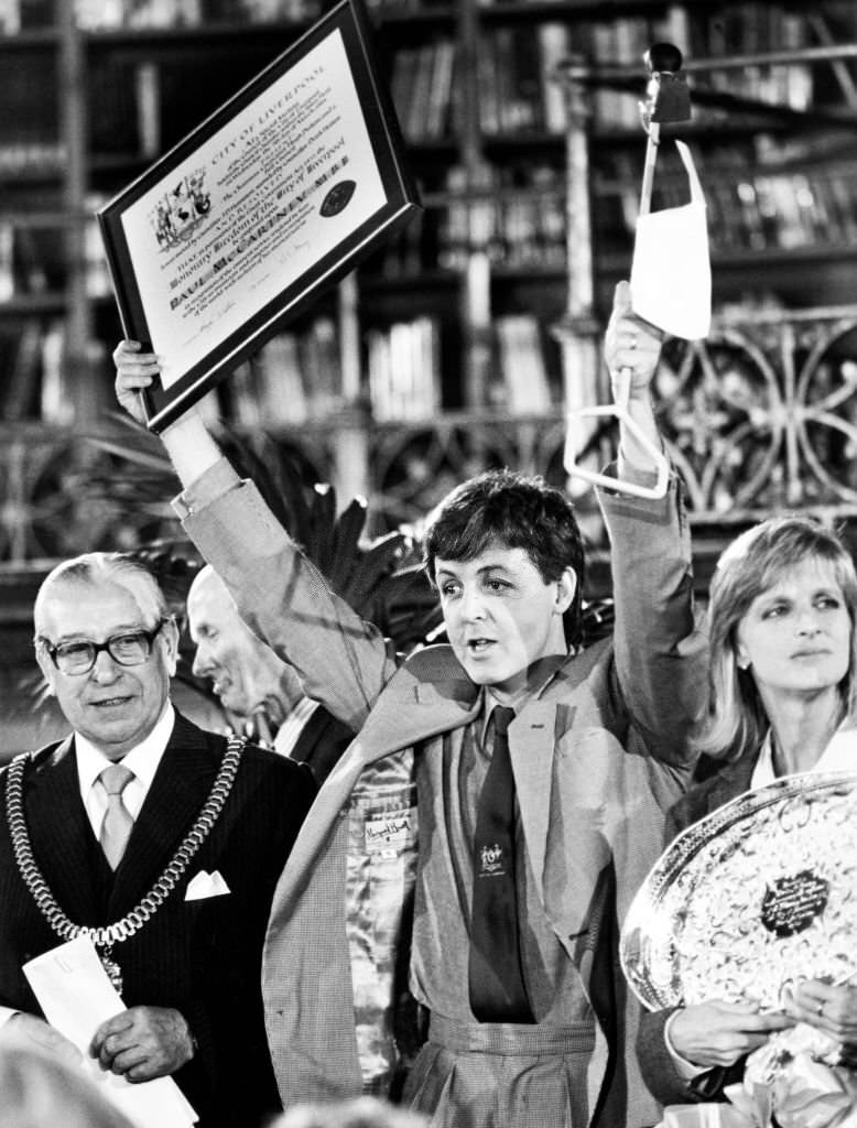 Paul McCartney awarded the title of Honorary Freedom of the City of Liverpool, with Linda McCartney and Councillor Hugh Dalton, 28th November 1984.