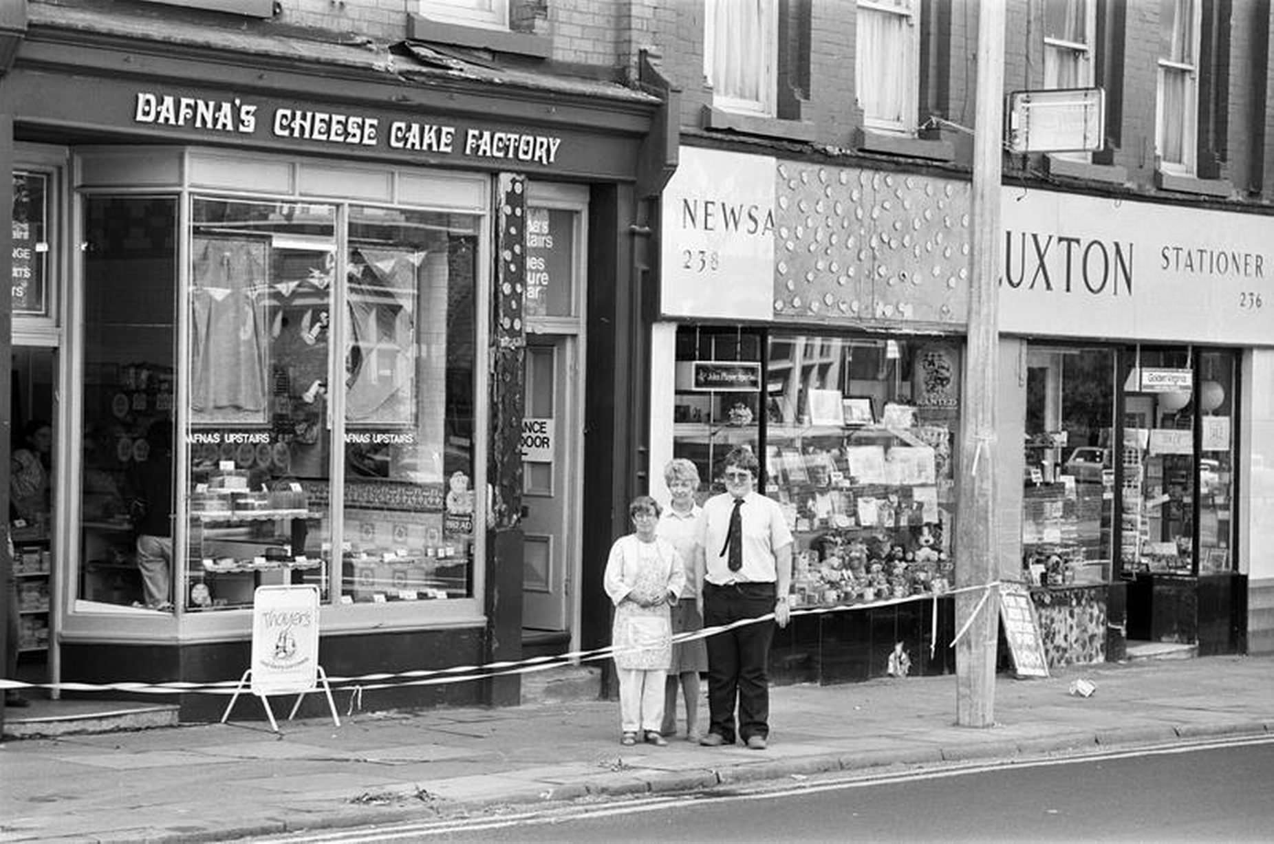 Smithdown Road shopkeepers Mrs Anne Lev (right) and Mrs Elsie Luxton and her son, John outside their damaged shops, 10th August 1985.