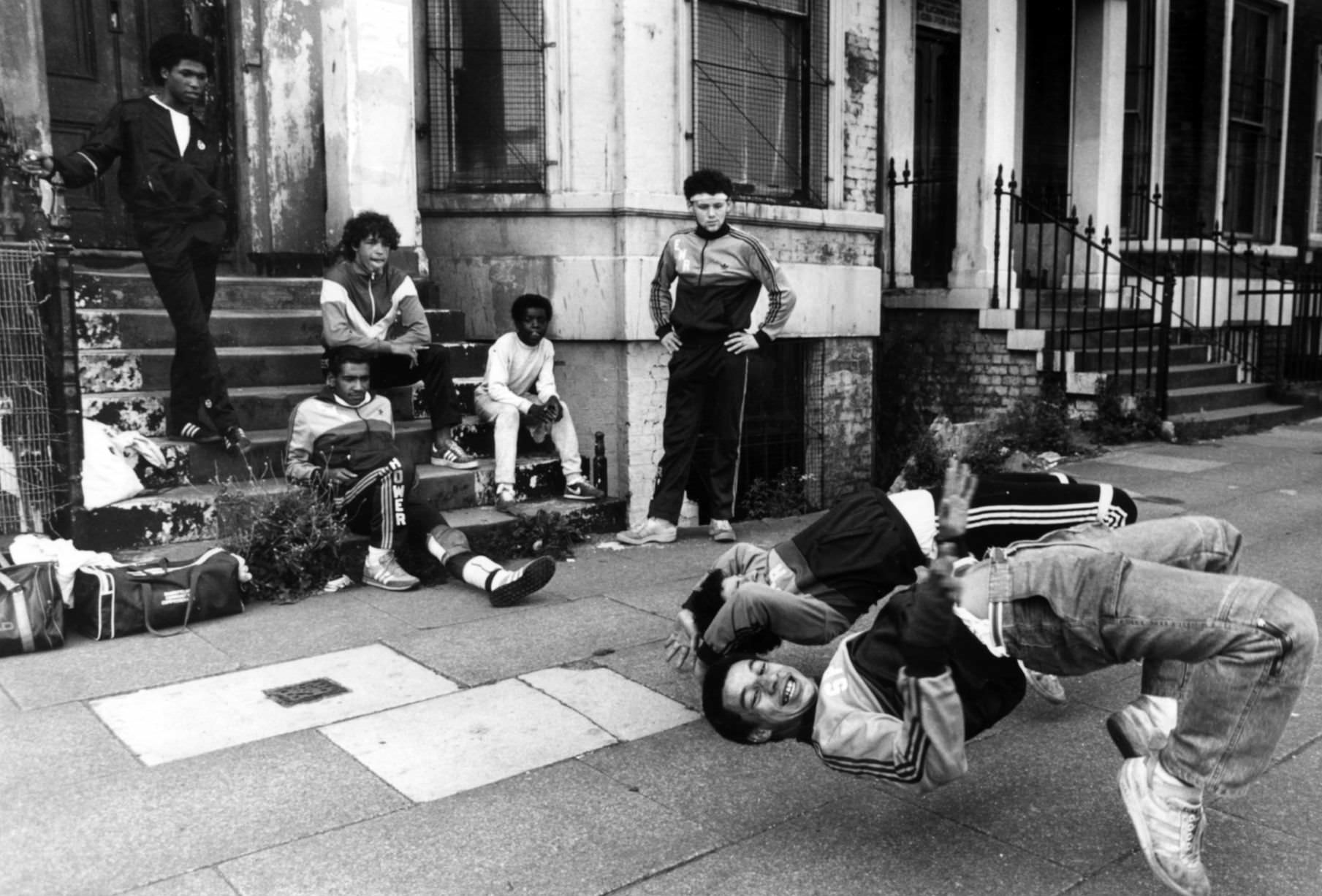 A group of breakdancers, the Eastwood Rockers, going through their break dancing paces on the streets of Liverpool.