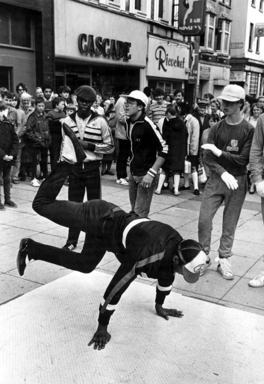 Street dance crew Broken Glass, in Clayton Square, Liverpool, demonstrating their moves, 6th October 1983