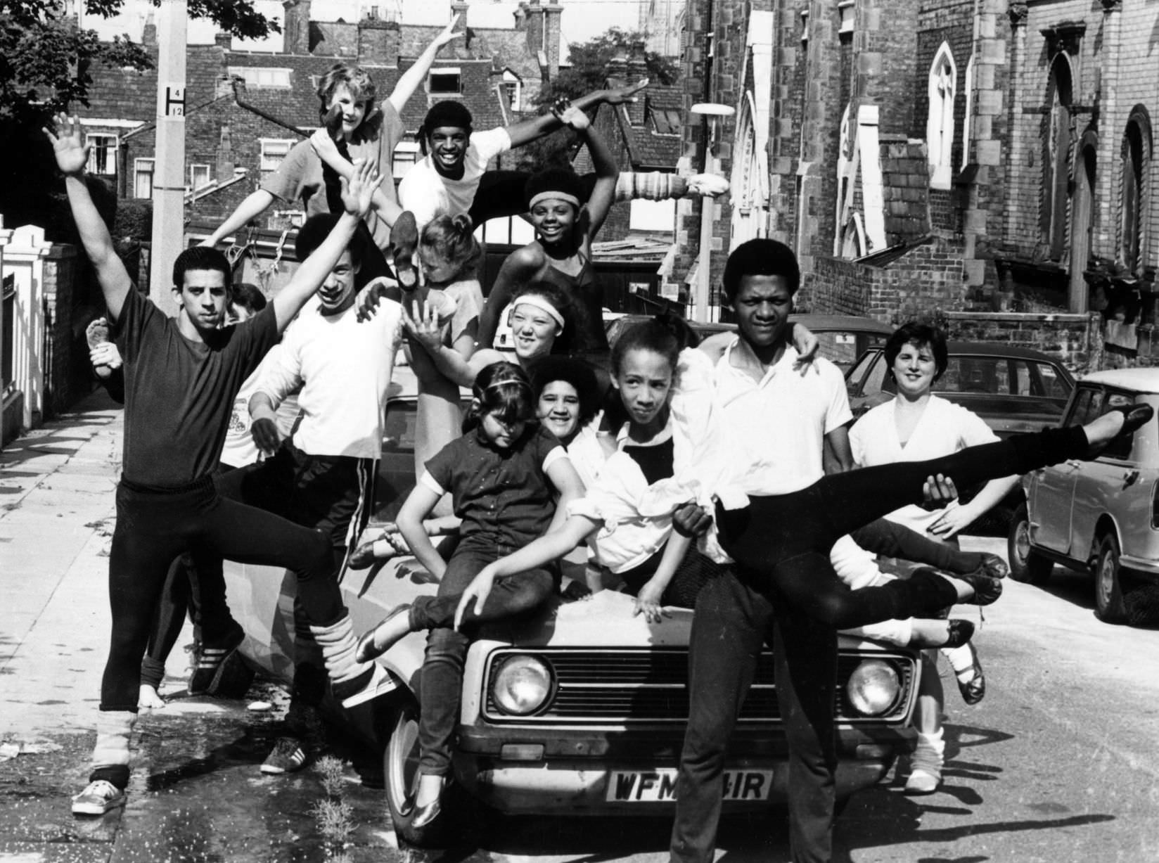 Shades of fame - as a group of Liverpool youngsters go through some dance routines during the summer holidays, 1982