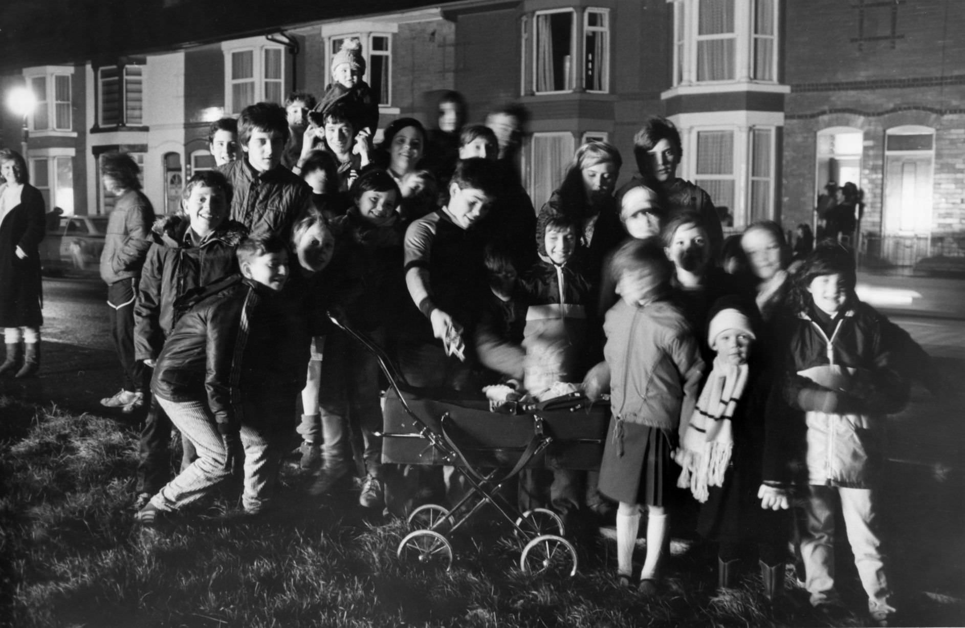 Residents of Hornby Boulevard, Bootle gather to watch a private bonfire and fireworks display, 5th November 1987