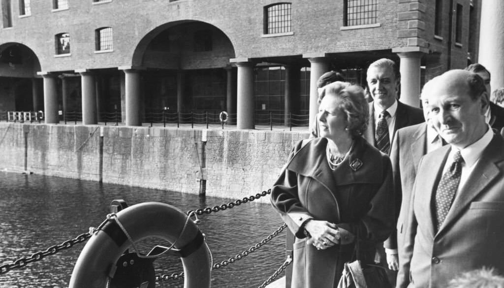 British Prime Minister Margaret Thatcher accompanied by Sir Leslie Young, observes the architecture of Albert Dock during her visit to the city of Liverpool, 3rd October 1984.