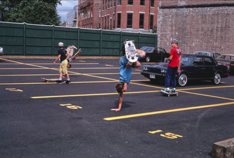 Skateboarding in Merrimack St. parking lot.