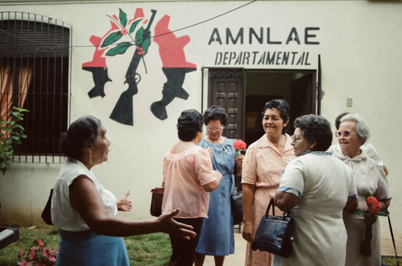 Doña Mercedes greets her friends at the AMLAE meeting house, Managua, Nicaragua, 1985