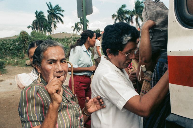 Doña Mercedes sits on the front patio with her son Julio, Managua, Nicaragua, 1985