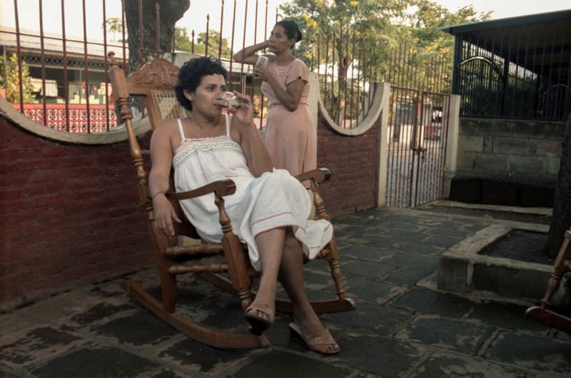 Drinking Coca-Cola on the front patio, Managua, Nicaragua, 1985