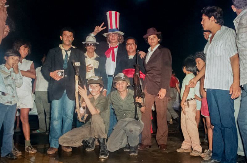 Celebration of the 6th anniversary, students dressed up at CIA, Contra-soldiers and Catholic priests to mock the opposition to the revolution, Managua, Nicaragua, 1985