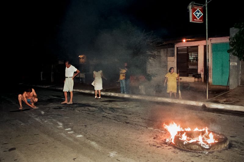 Tires burn in the streets of Managua to celebrate the 6th anniversary of the revolution, Managua, Nicaragua, 1985