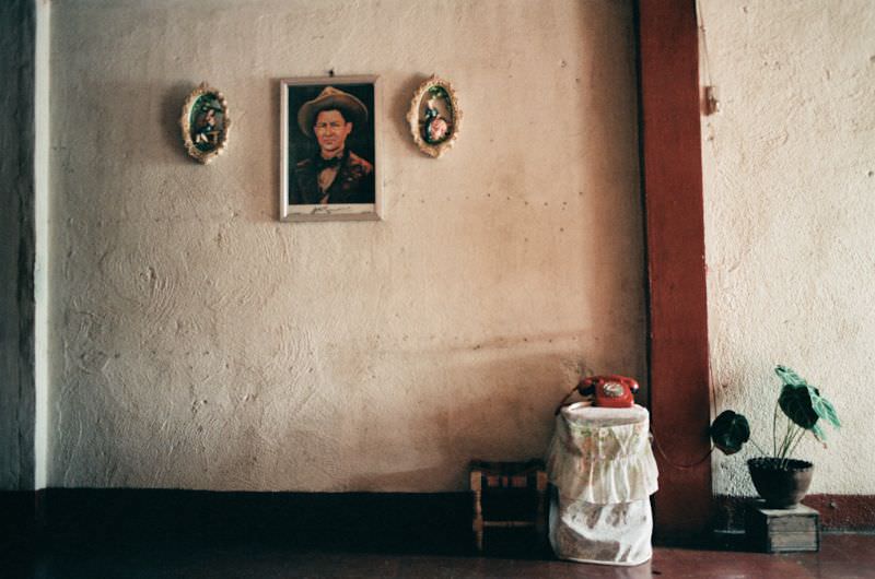 A previously-banned portrait of Augusto Sandino hangs in the living room of the Montano home, Managua, Nicaragua, 1985