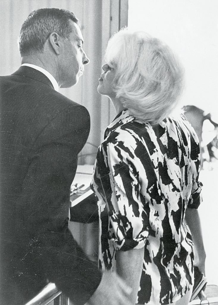 Marilyn Monroe Kissing Joe DiMaggio as she leaves here for Mexico and a vacation