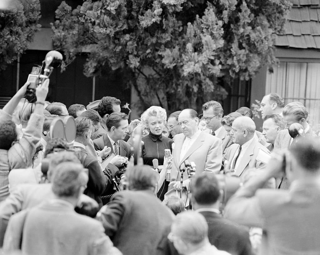 Marilyn Monroe being Swamped by the Press.