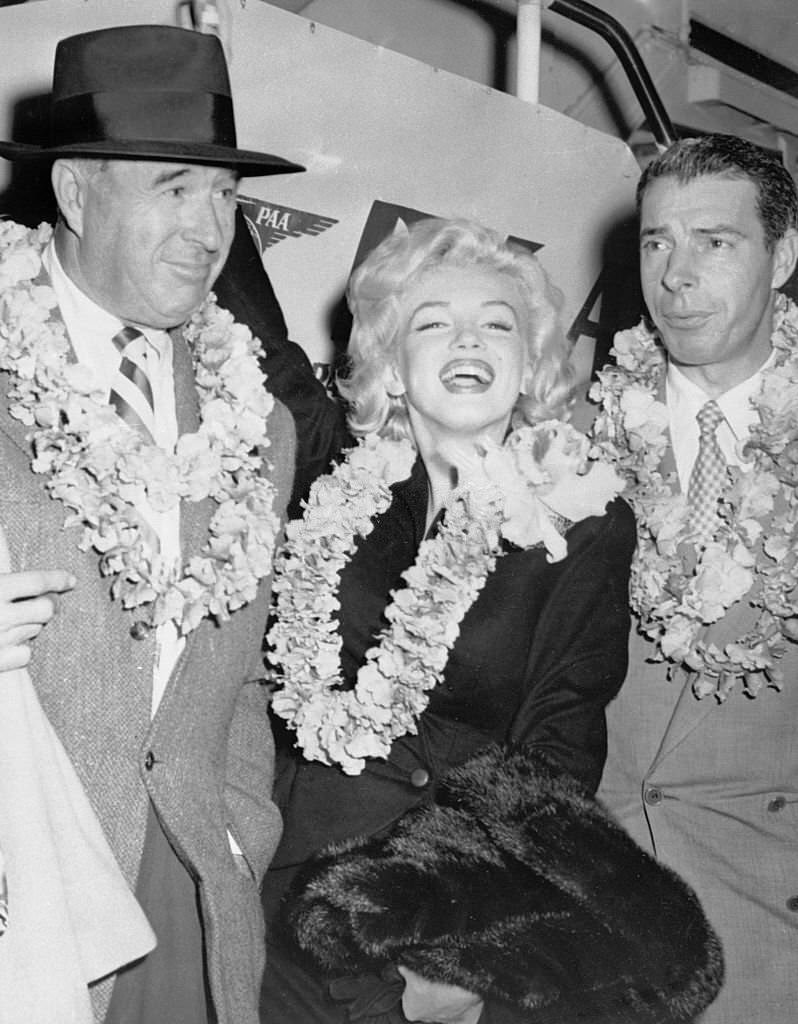 Marilyn Monroe and Joe Dimaggio. They are enroute to Tokyo to open the 1954 Japanese baseball season.