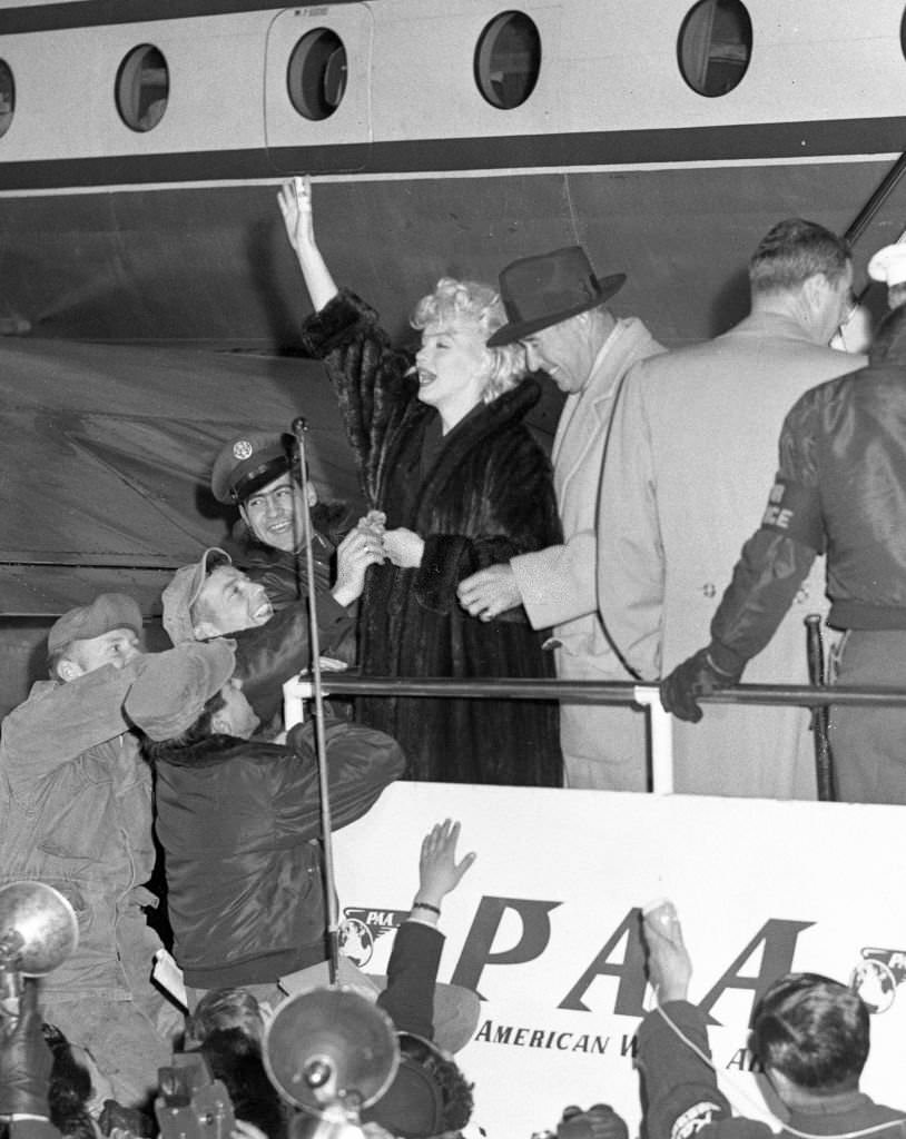 Marilyn Monroe and Joe DiMaggio are seen on arrival at the Imperial Hotel on February 1, 1954 in Tokyo.