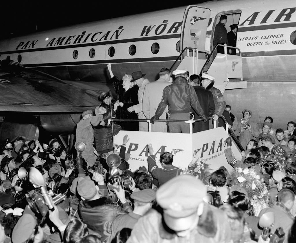 Marilyn Monroe and Joe DiMaggio are seen on arrival at the Imperial Hotel.