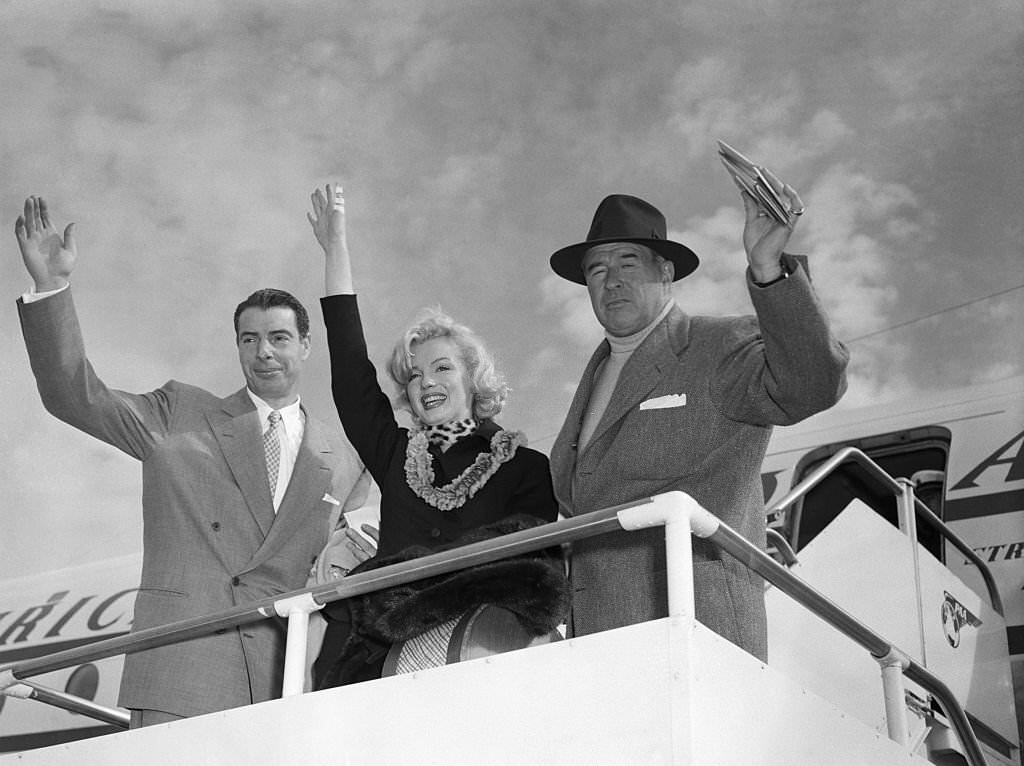 Marilyn Monroe and Joe DiMaggio waving from Plane, 1954