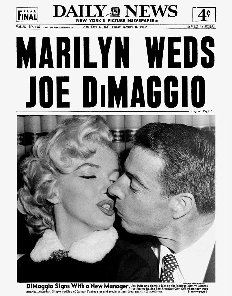 Joe DiMaggio plants a kiss on the luscious Marilyn Monroe just before leaving San Francisco City Hall.